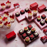 a group of small cakes and boxes