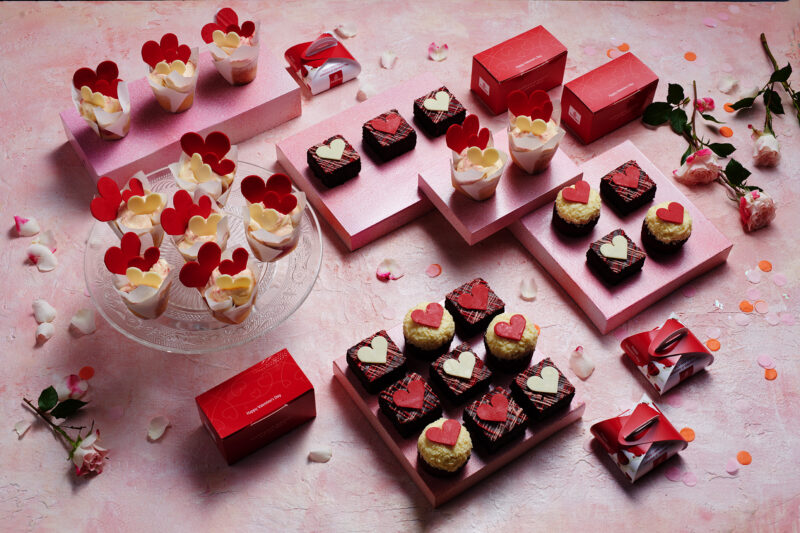 a group of small cakes and boxes