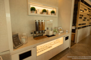 a counter with food dispensers and shelves