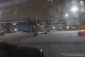 an airplane on the tarmac at night