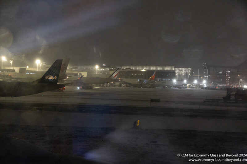 airplanes on a runway at night