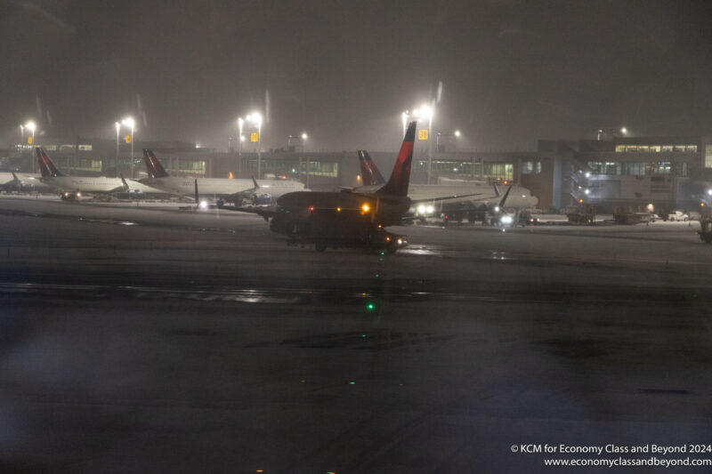 airplanes on a runway at night