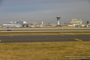 a runway with a tower in the background