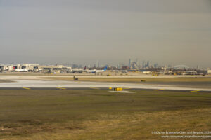 an airport with a city in the background