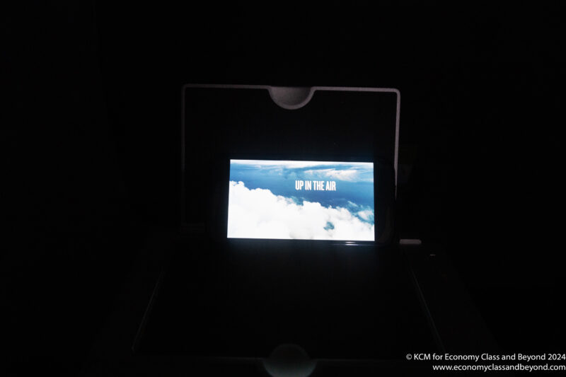 a screen with a picture of clouds in the dark