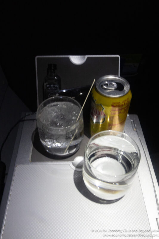 a drink and a glass on a tray
