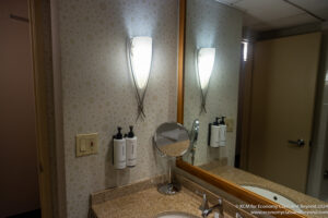 a bathroom with a mirror and a sink