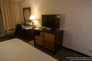 a room with a television and a table