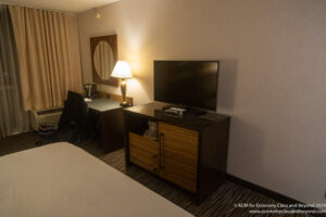 a room with a television and a table