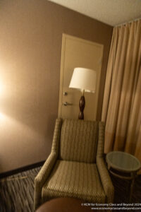 a chair with a lamp on top of it