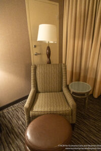 a chair and a lamp in a room