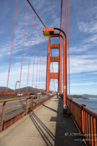 Golden Gate Bridge with cars and people walking on it