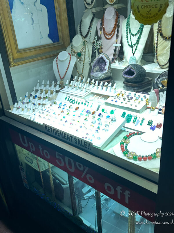 a display case with jewelry on display