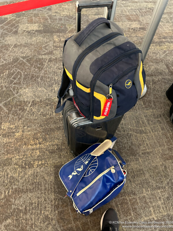 a backpack and a bag on the floor