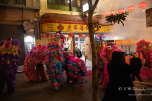 a group of people in clothing outside a building