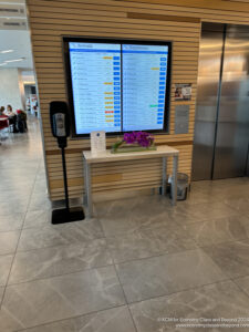a screen with a phone and a table in front of it