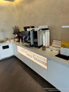 a coffee machine and cups on a counter