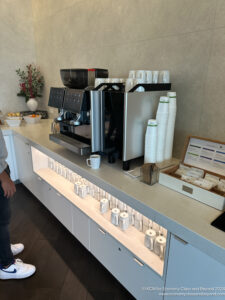 a coffee machine and cups on a counter