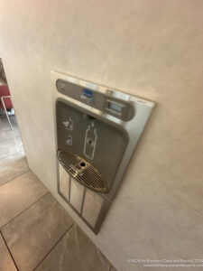 a water dispenser on a wall