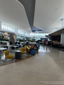 a large airport with tables and chairs