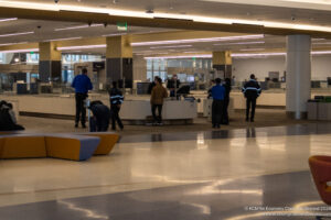 people in a building with people standing around