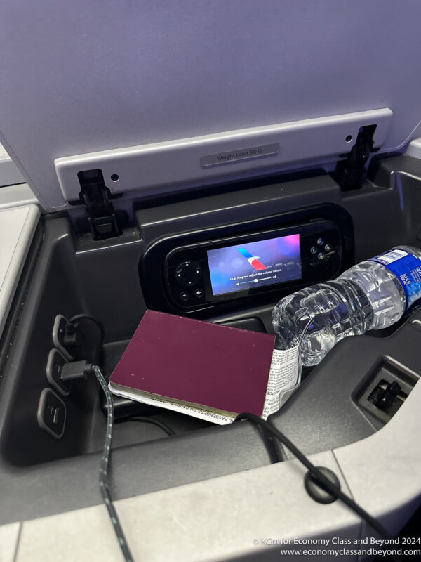 a passport and a water bottle in a car