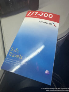 a blue and white brochure on a grey surface