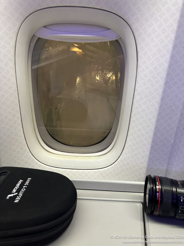 a camera and a window on an airplane