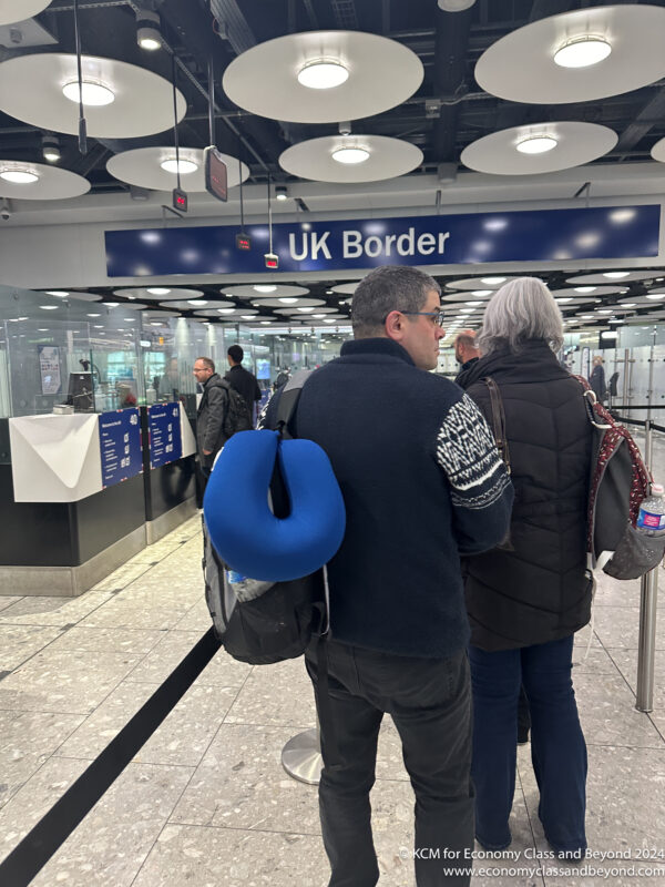 a man and woman standing in a terminal