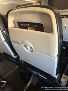 a seat with a magazine in it