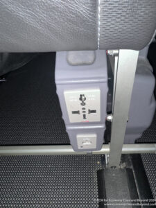 a grey electrical outlet in a vehicle