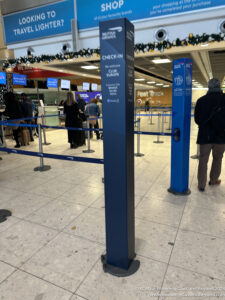 a group of people standing in a line at an airport