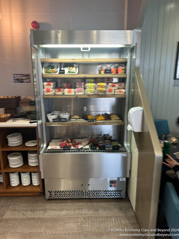 a refrigerator with food on shelves
