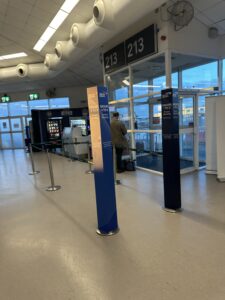 a man standing in front of a glass door