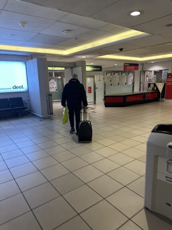 a person with luggage in a room
