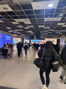 a group of people walking in an airport