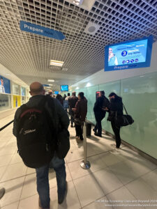 a group of people walking in a hallway