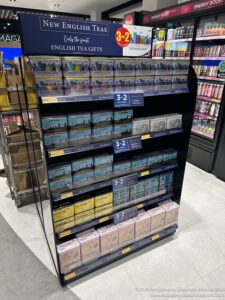 a shelf with boxes of tea in it