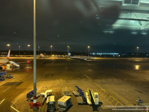 an airplane on the tarmac at night