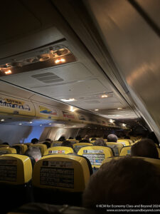a group of people sitting in an airplane
