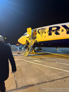a man walking towards an airplane