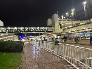 a walkway and walkway with lights at night