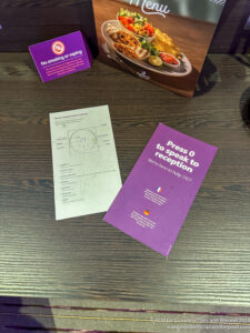 a table with a few paper and a box