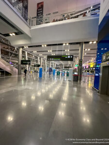 a large airport with a large walkway and stairs