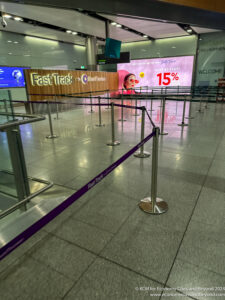 a large airport terminal with a sign on it