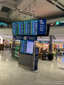 a screen with information in a airport