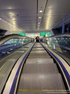 a group of people on an escalator