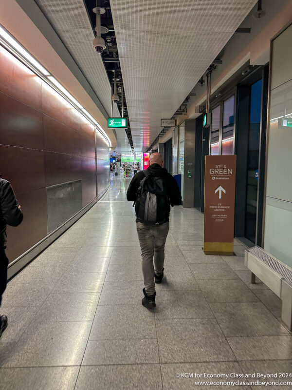 a man walking down a hallway