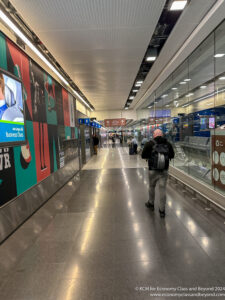 a man walking in a hallway
