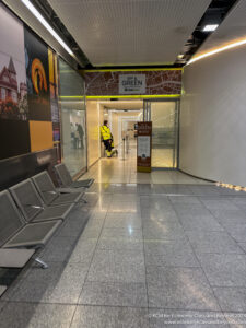 a person in a yellow jacket in a hallway